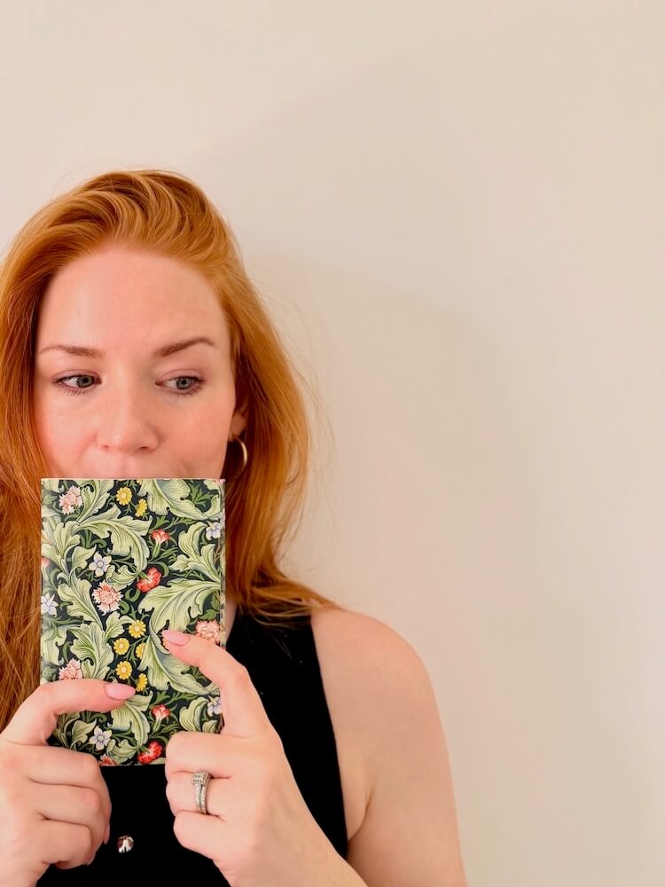 Amanda Black top notebook in front of face